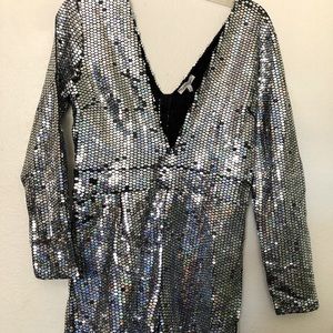Women’s long sleeve mini-length sequined jump suit/romper.  Size L.